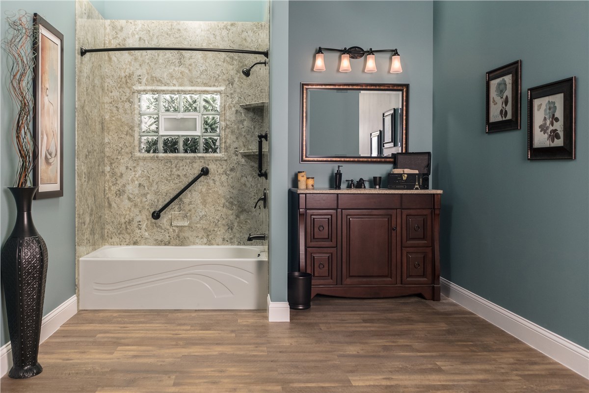 A bathroom featuring blue walls and wooden floors, creating a serene and inviting atmosphere.