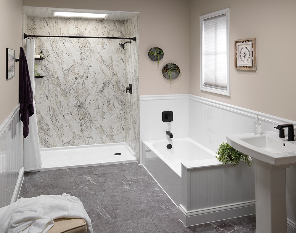 A bathroom featuring a shower, a bathtub, and a toilet, designed for functionality and comfort.