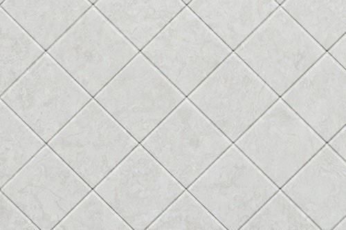 A white tile wall featuring a diamond pattern, creating a textured and visually appealing surface