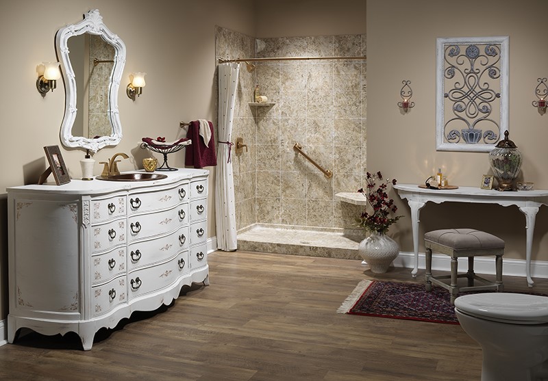 A modern bathroom featuring a shower, toilet, and vanity with a sleek design and neutral color scheme.