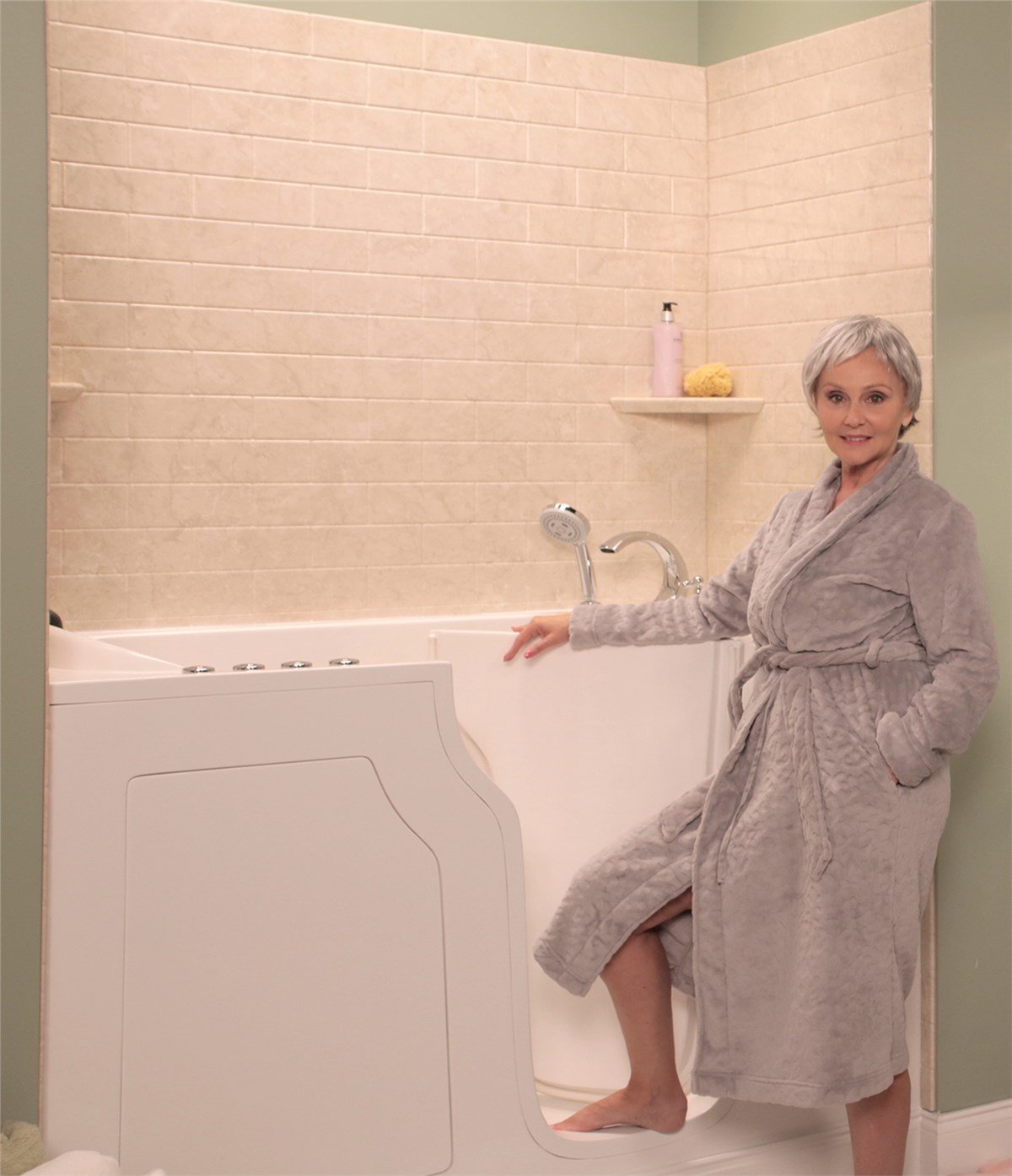 A woman in a bathrobe is showcasing a unique bathtub