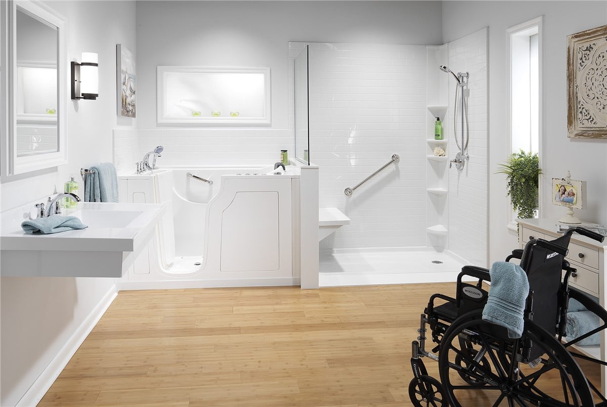 A wheelchair accessible bathroom featuring a shower and toilet, designed for ease of use and mobility.